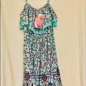 Dress with bright flowers and Lacey outline.